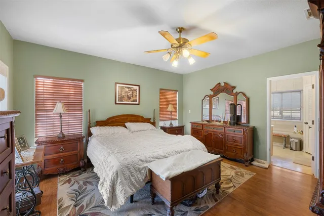 a kitchen with a sink and chairs