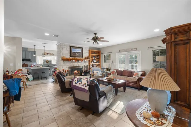 a view of a dining room with furniture and a chandelier