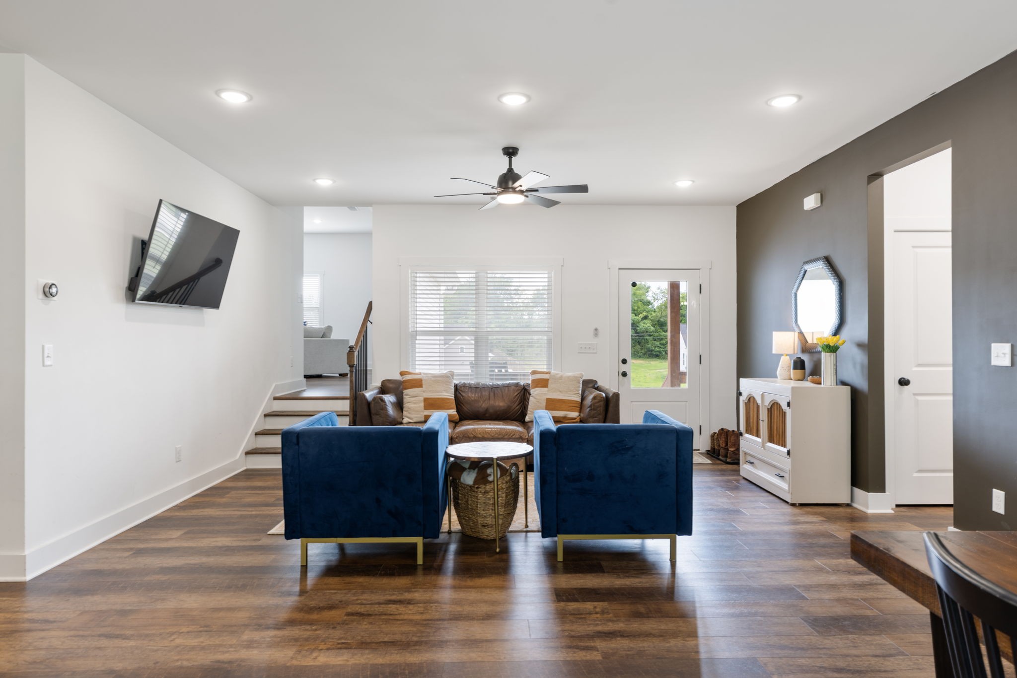 1578 Angus Way Greenbrier, TN 37073 - Photo 5 of 45 a living room with furniture a flat screen tv and wooden floor