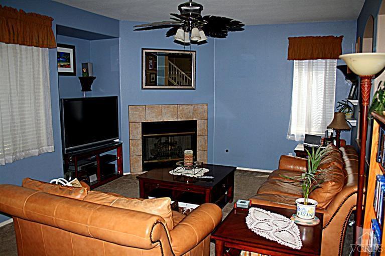 968 Roldan Avenue Simi Valley, CA 93065 - Photo 5 of 20 a living room with furniture a flat screen tv and a fireplace