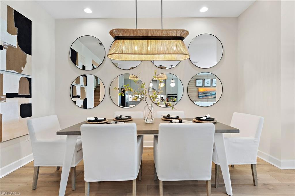 12760 Springbrook Court Estero, FL 33928 - Photo 4 of 17 a kitchen with a dining table and chairs