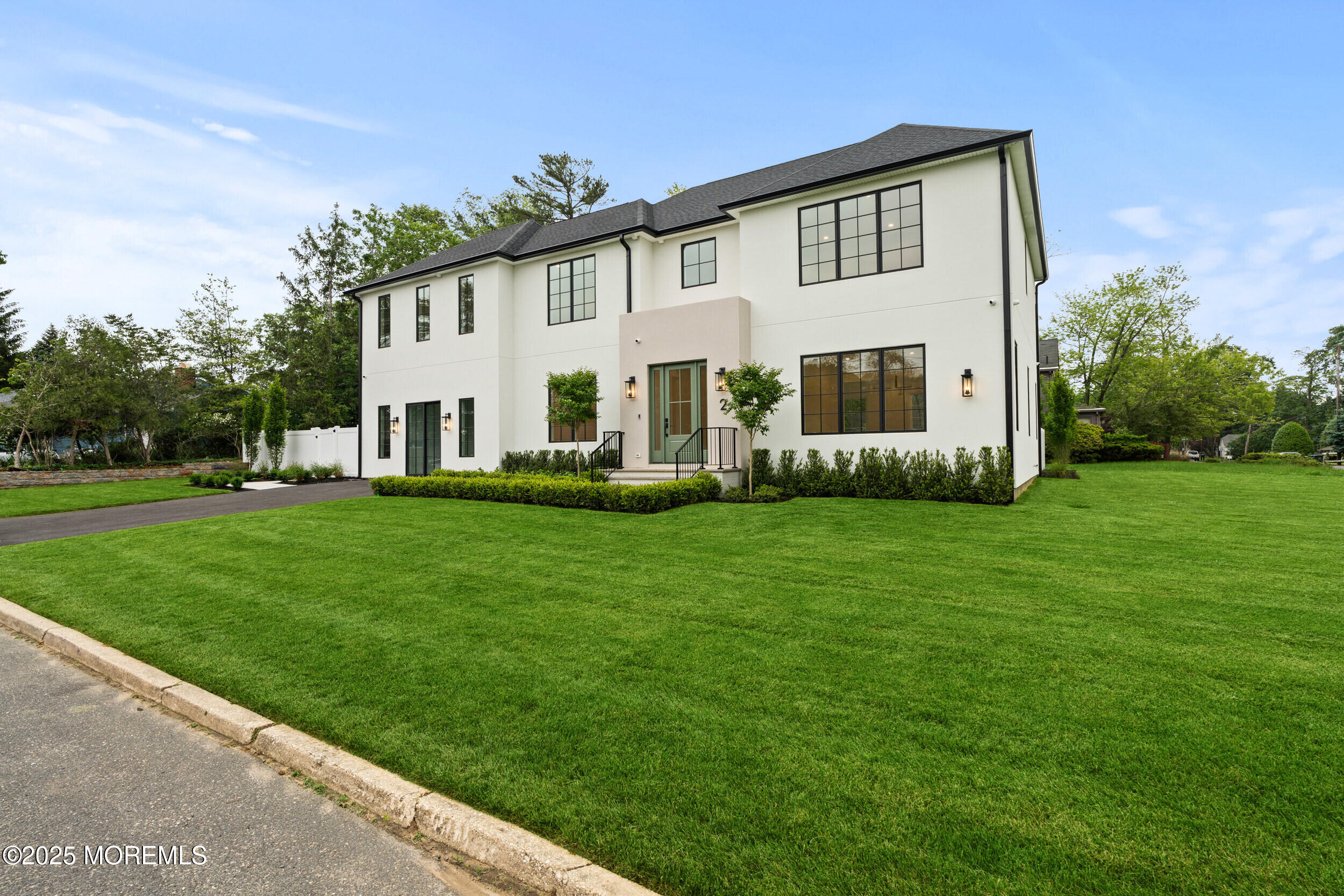 2 Deborah Place Oakhurst, NJ 07755 - Photo 2 of 82 a front view of house with yard and green space