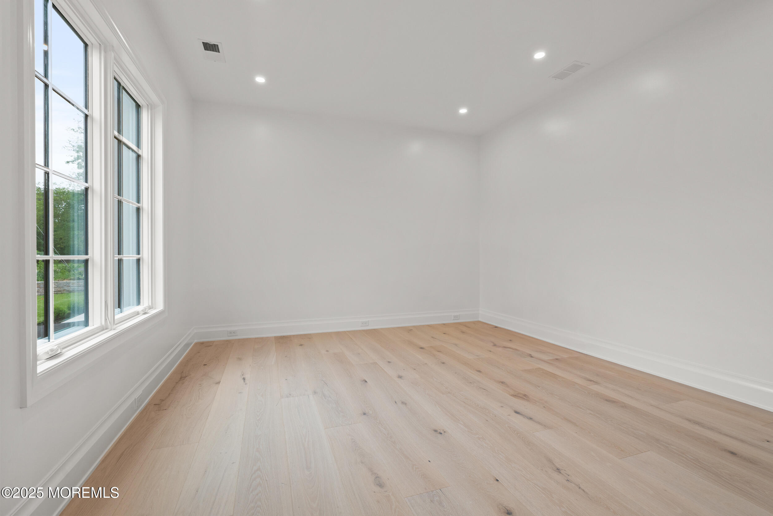2 Deborah Place Oakhurst, NJ 07755 - Photo 29 of 82 a view of empty room with wooden floor and fan