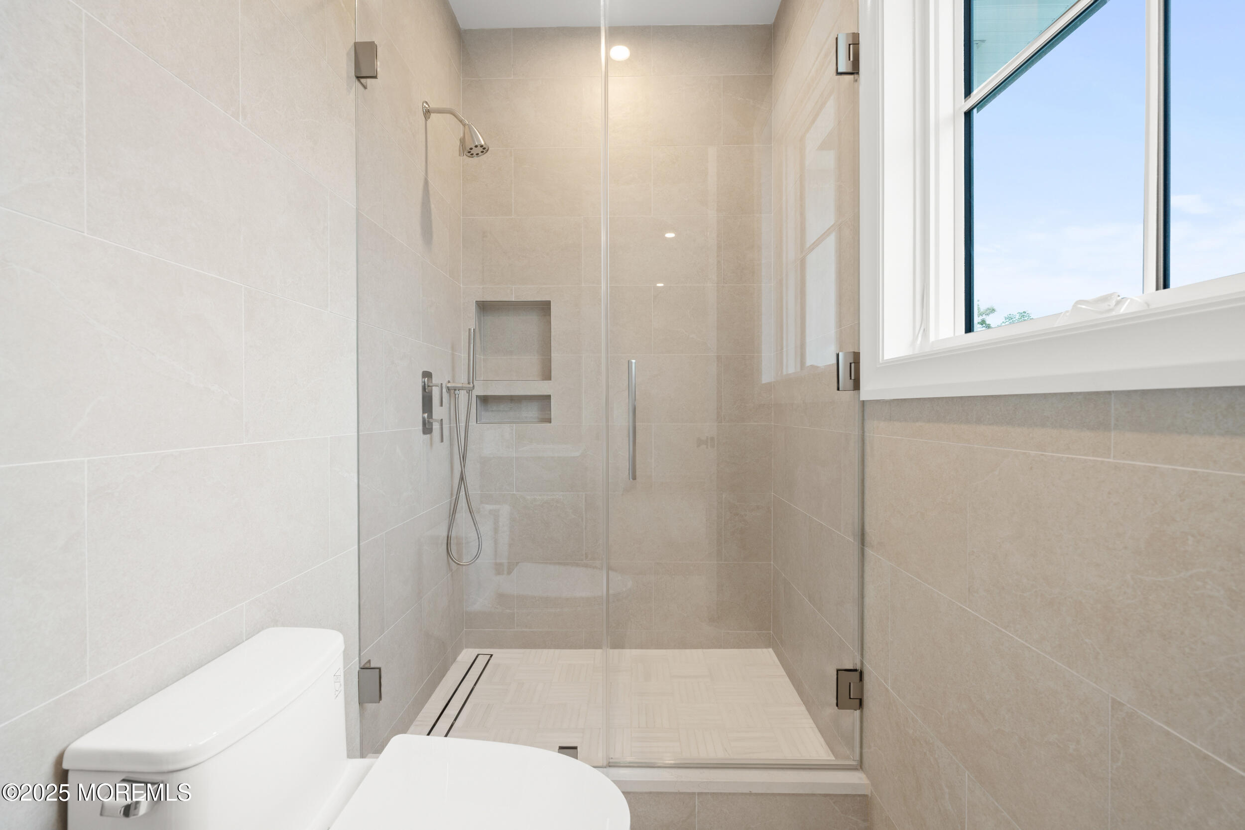2 Deborah Place Oakhurst, NJ 07755 - Photo 51 of 82 a bathroom with a shower a toilet and a window