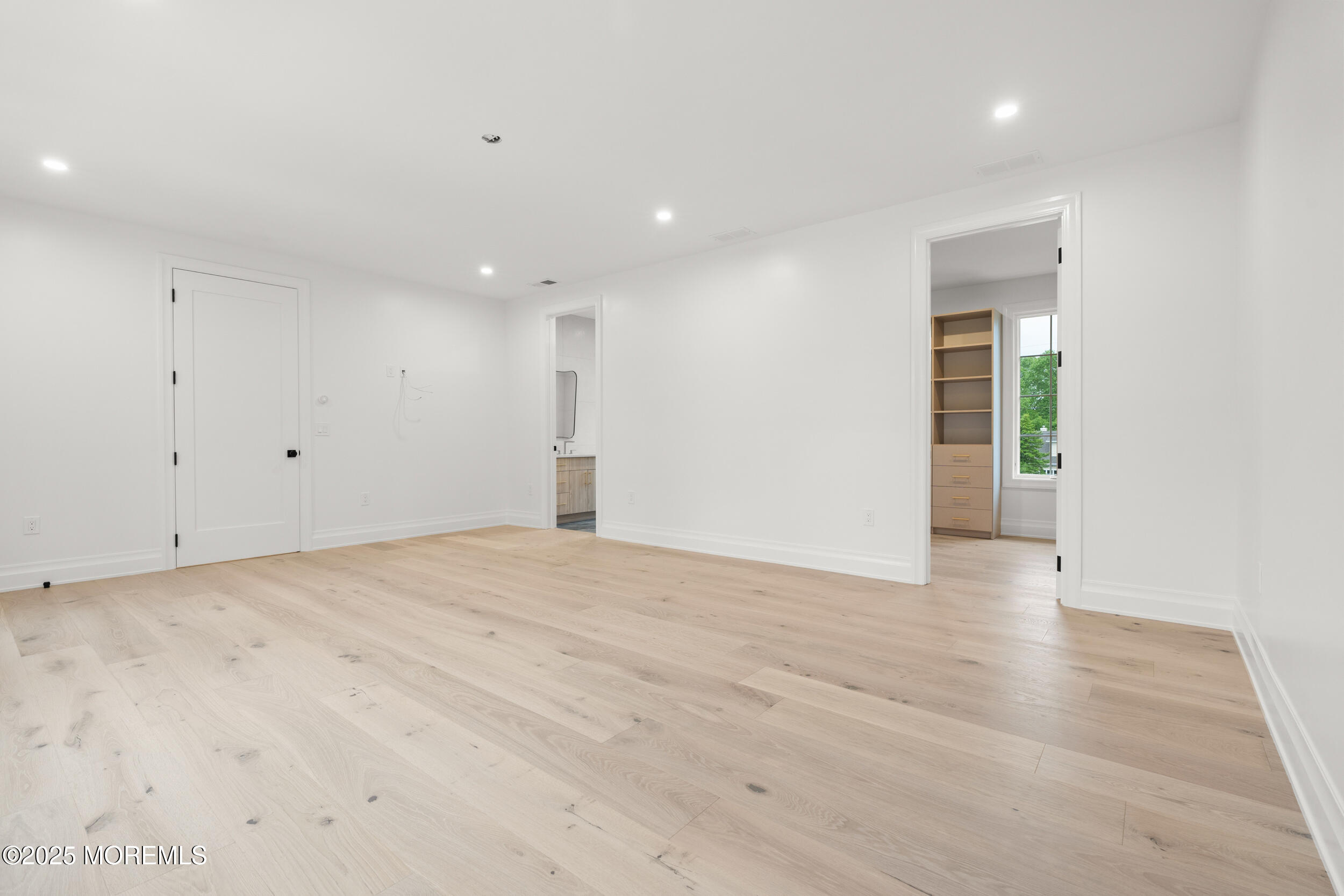 2 Deborah Place Oakhurst, NJ 07755 - Photo 56 of 82 a view of an empty room with wooden floor