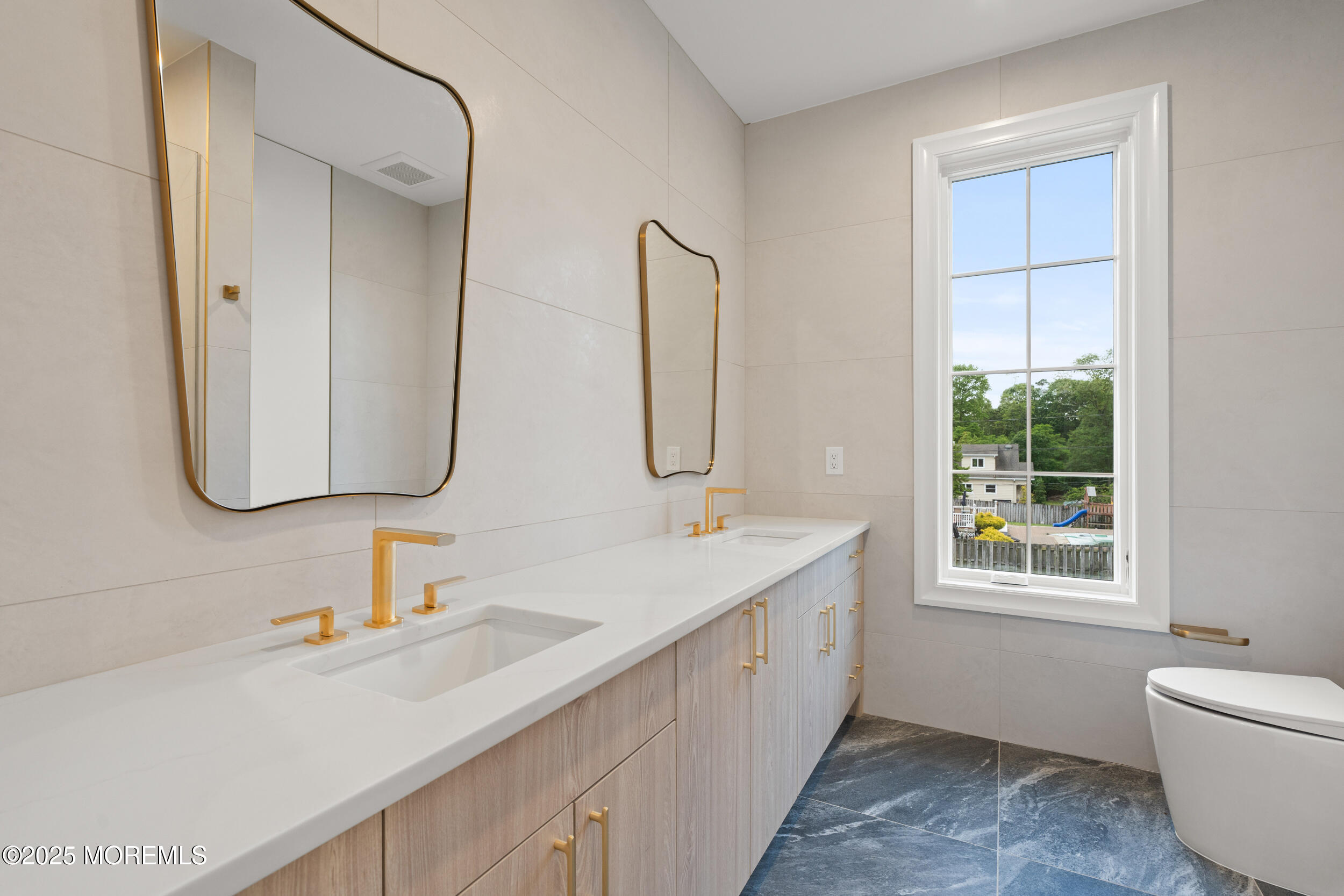 2 Deborah Place Oakhurst, NJ 07755 - Photo 57 of 82 a bathroom with a double vanity sink window and mirror