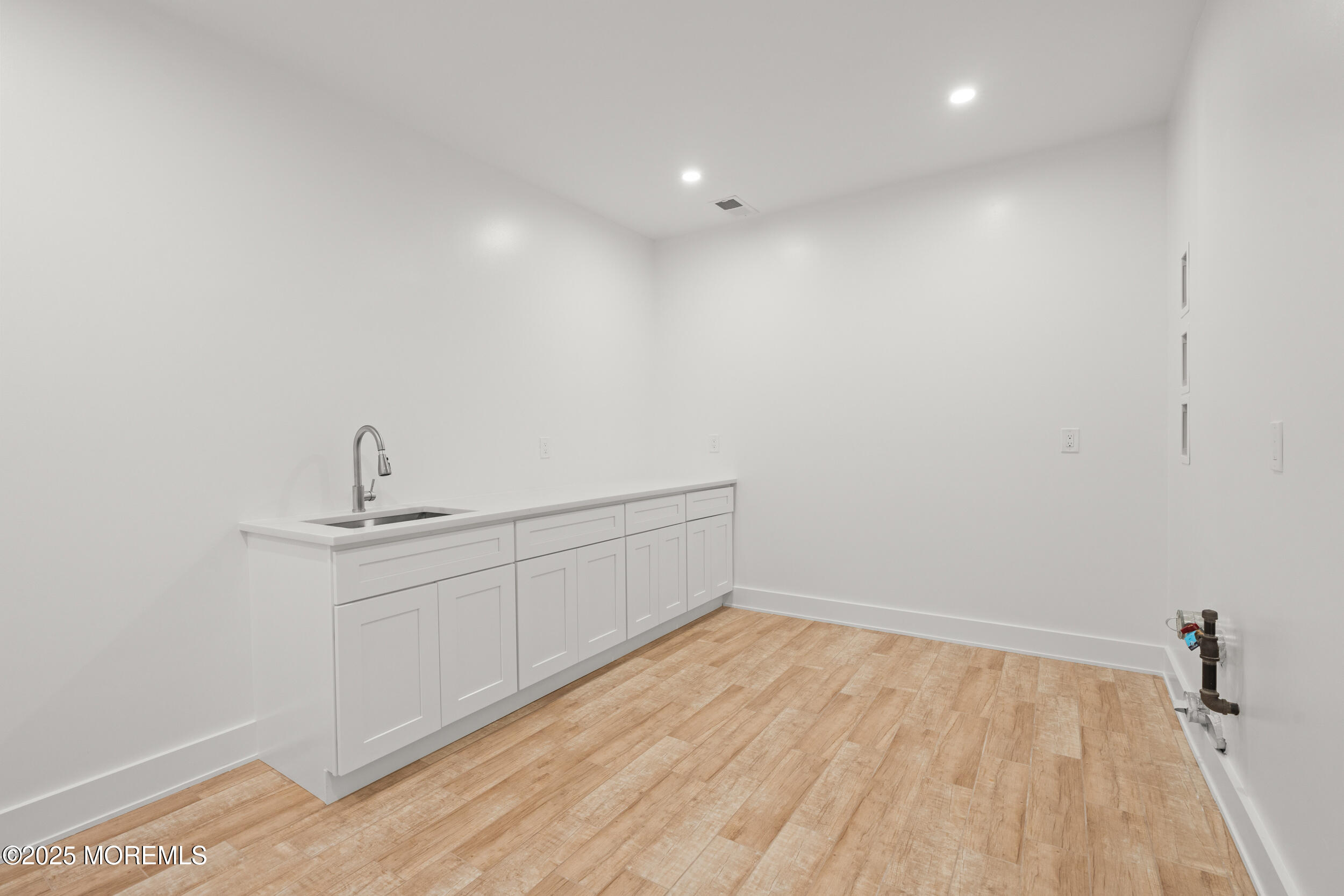 2 Deborah Place Oakhurst, NJ 07755 - Photo 69 of 82 a view of a room with wooden floor and sink