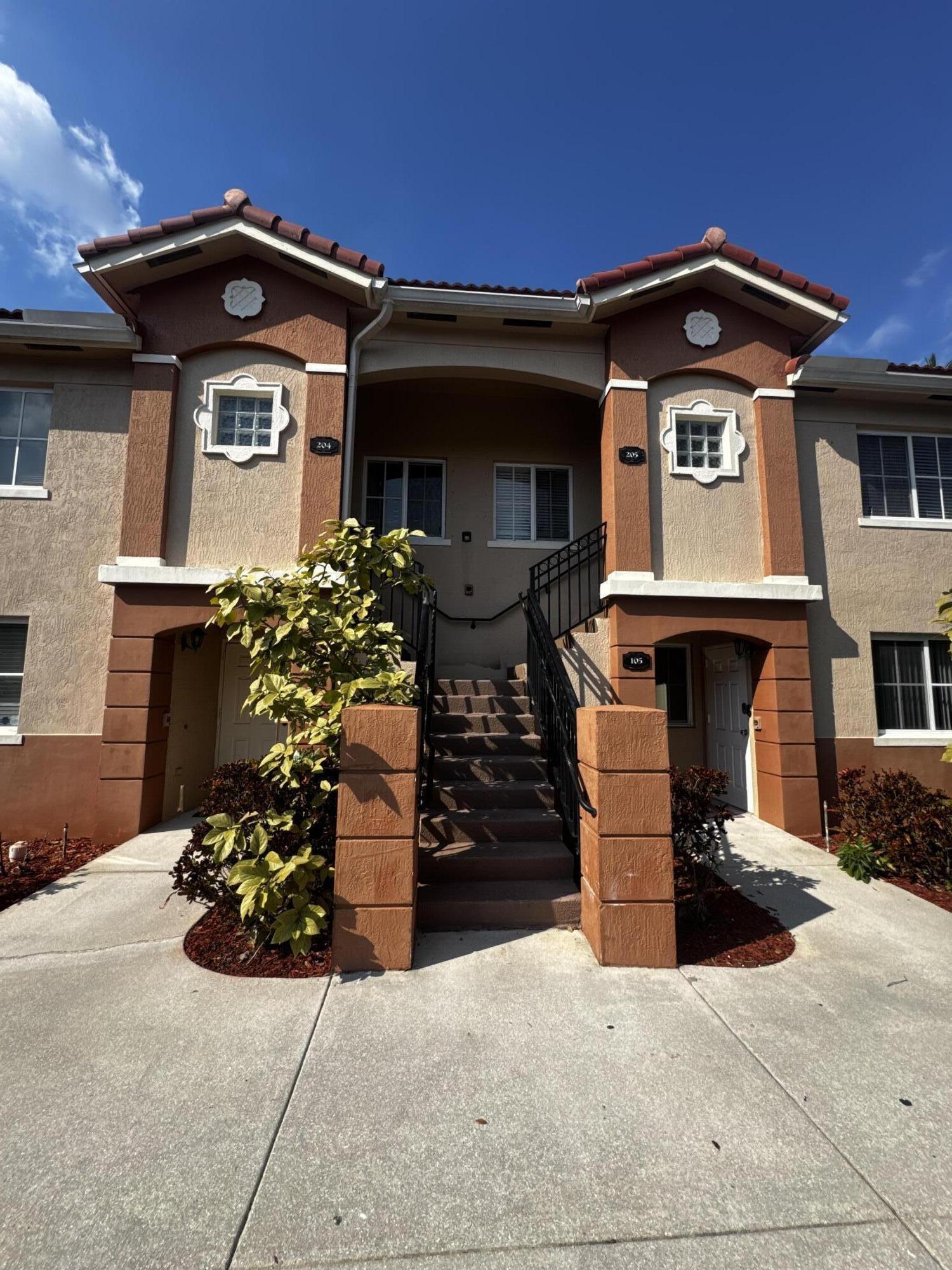 a front view of a house with parking