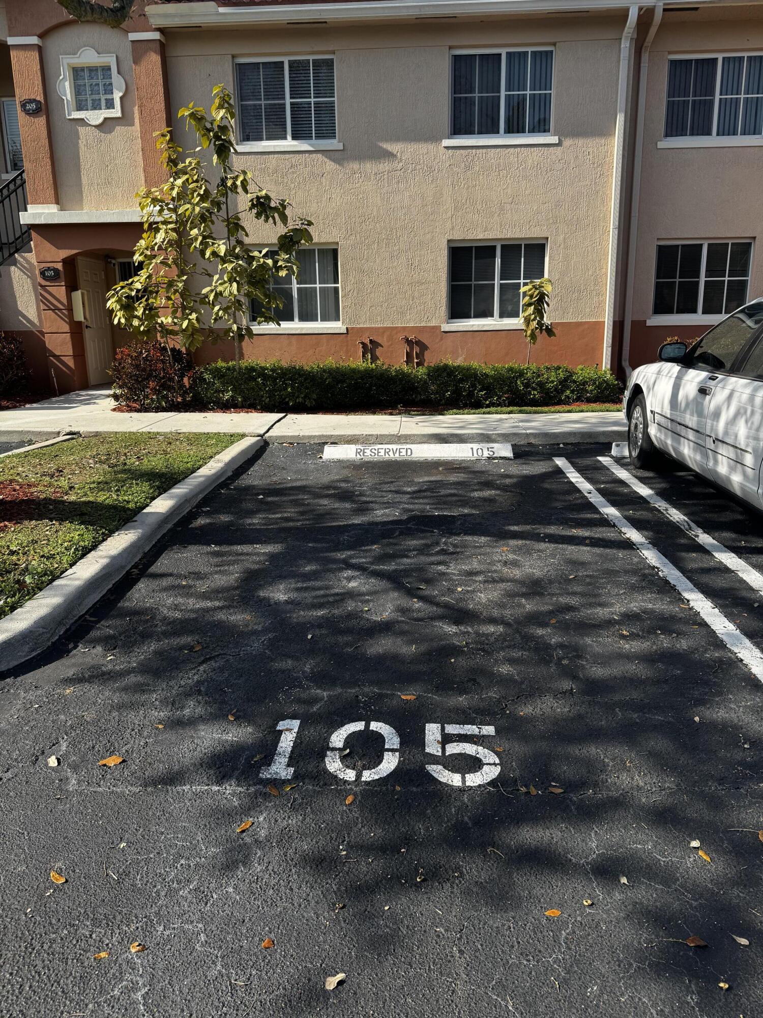 3810 North Jog Road, Unit 105 Royal Palm Beach, FL 33411 - Photo 21 of 26 a view of a street with cars