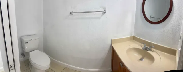 a bathroom with a toilet and a sink