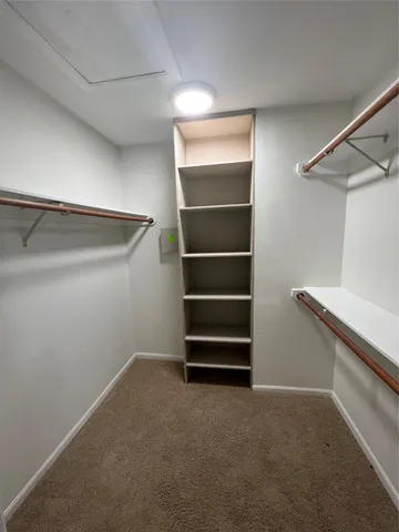a view of an empty walk in closet