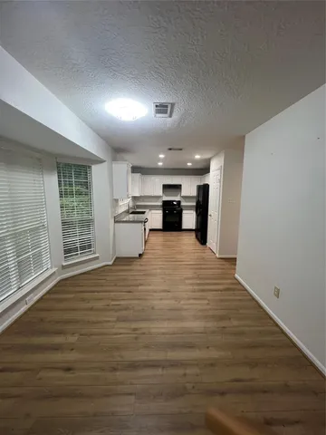 a view of a kitchen with a sink