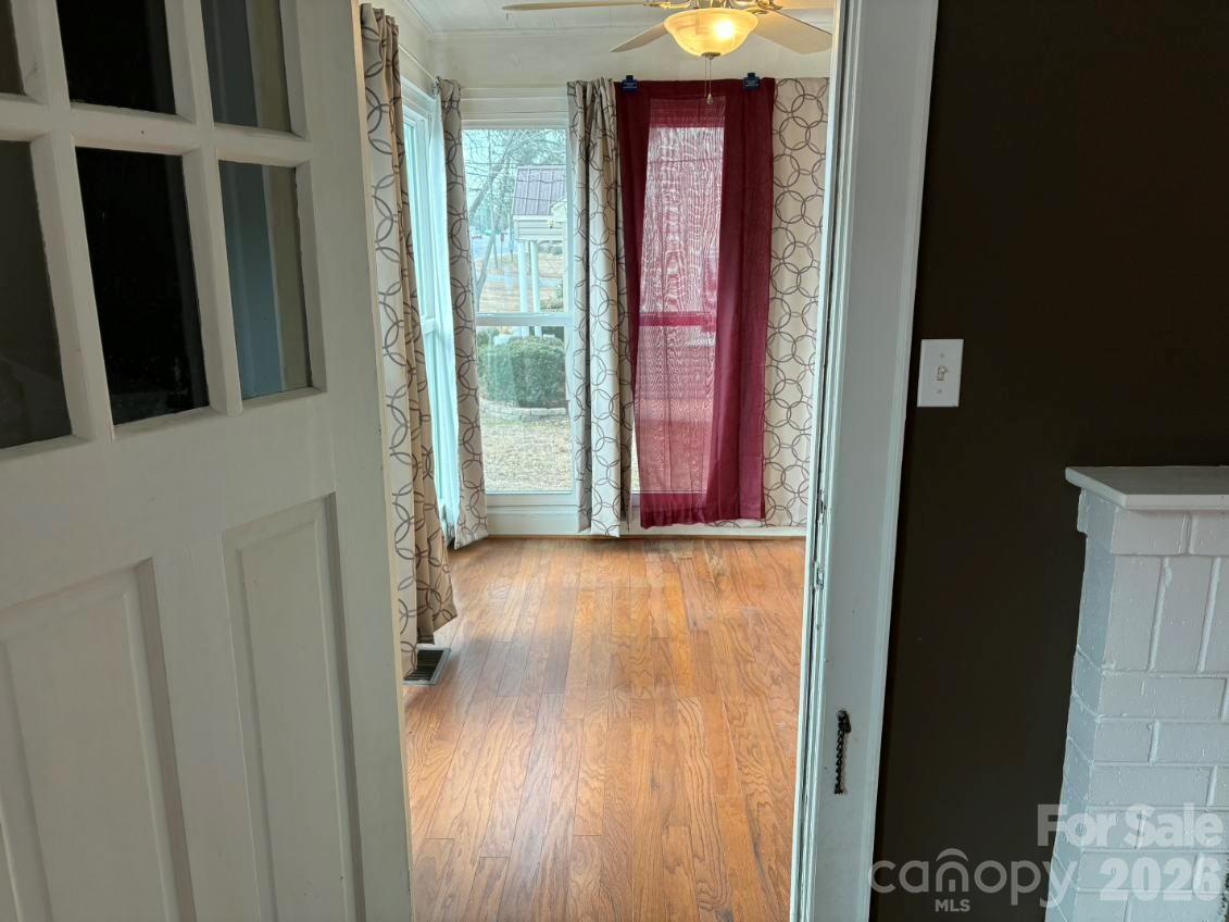 1507 Fayetteville Road Rockingham, NC 28379 - Photo 2 of 28 a view of a hallway with wooden floor and closet