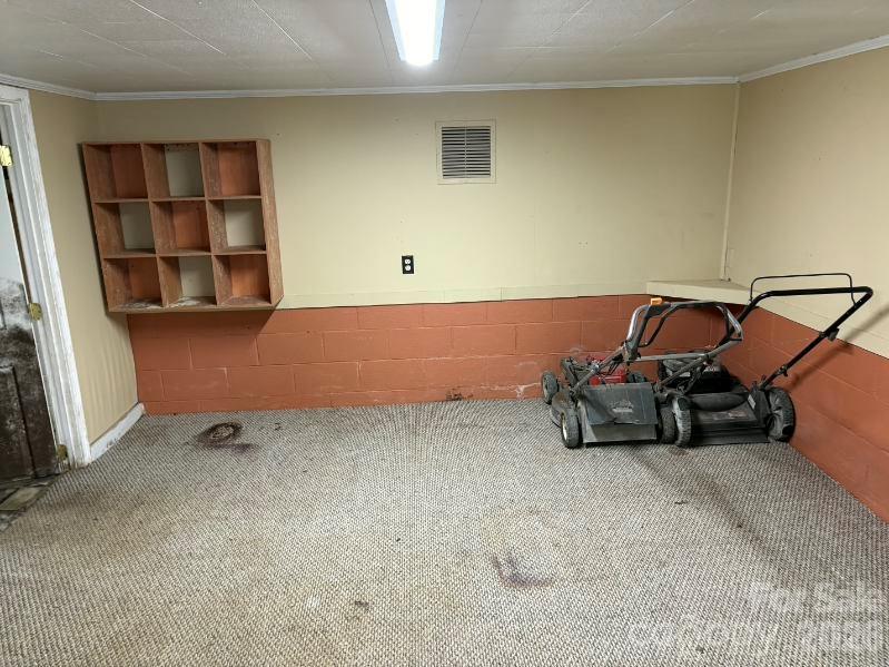 1507 Fayetteville Road Rockingham, NC 28379 - Photo 21 of 28 a room with a bed and a book shelf