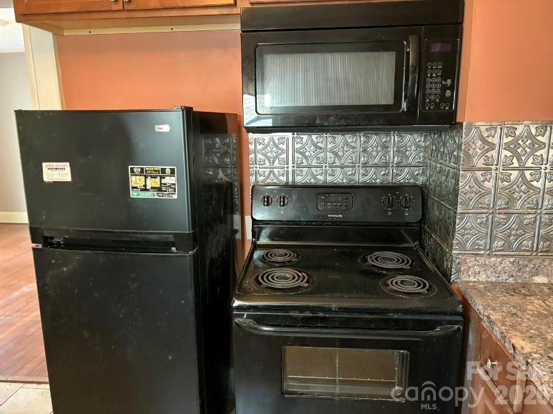 1507 Fayetteville Road Rockingham, NC 28379 - Photo 10 of 28 a stove top oven sitting inside of a kitchen