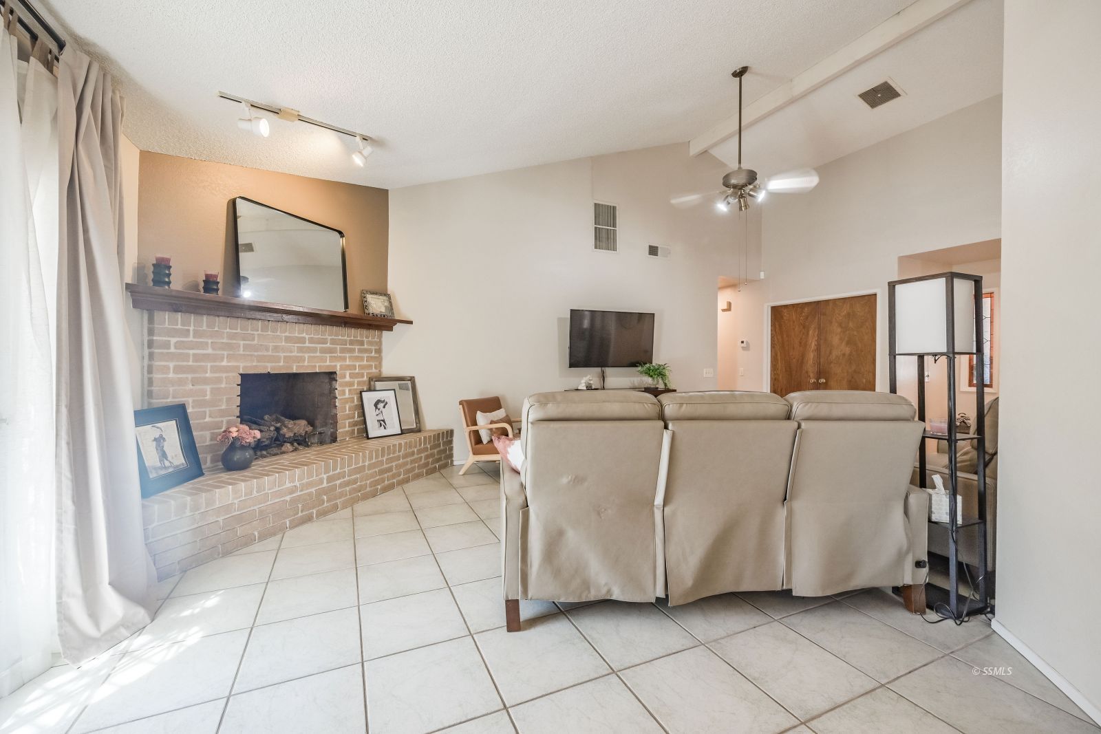 425 Mt Shasta Circle Ridgecrest, CA 93555 - Photo 10 of 47 a living room with furniture and a fireplace