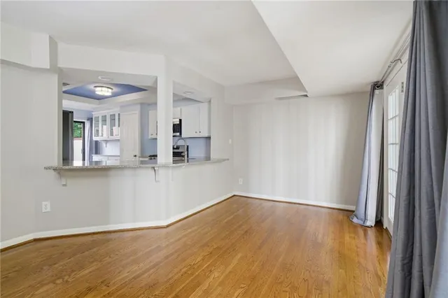 a view of a kitchen cabinets and wooden floor