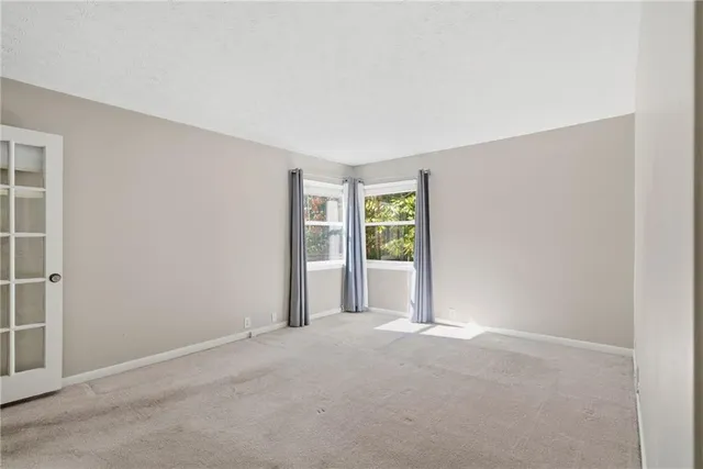 a bathroom with a toilet and a bathtub