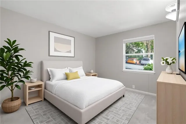 a bathroom with a granite countertop sink a toilet and shower