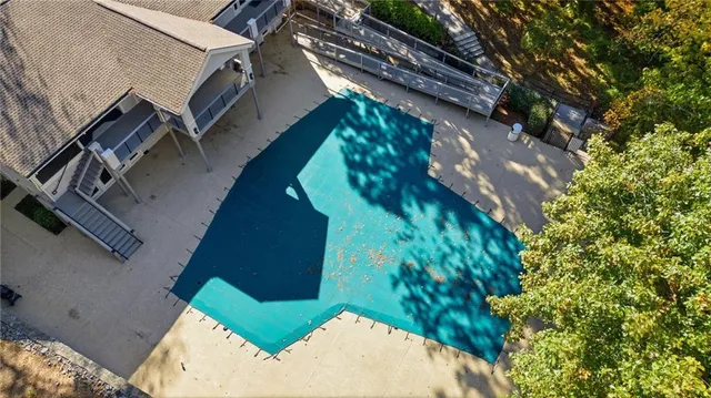 an aerial view of a house with a yard and garden