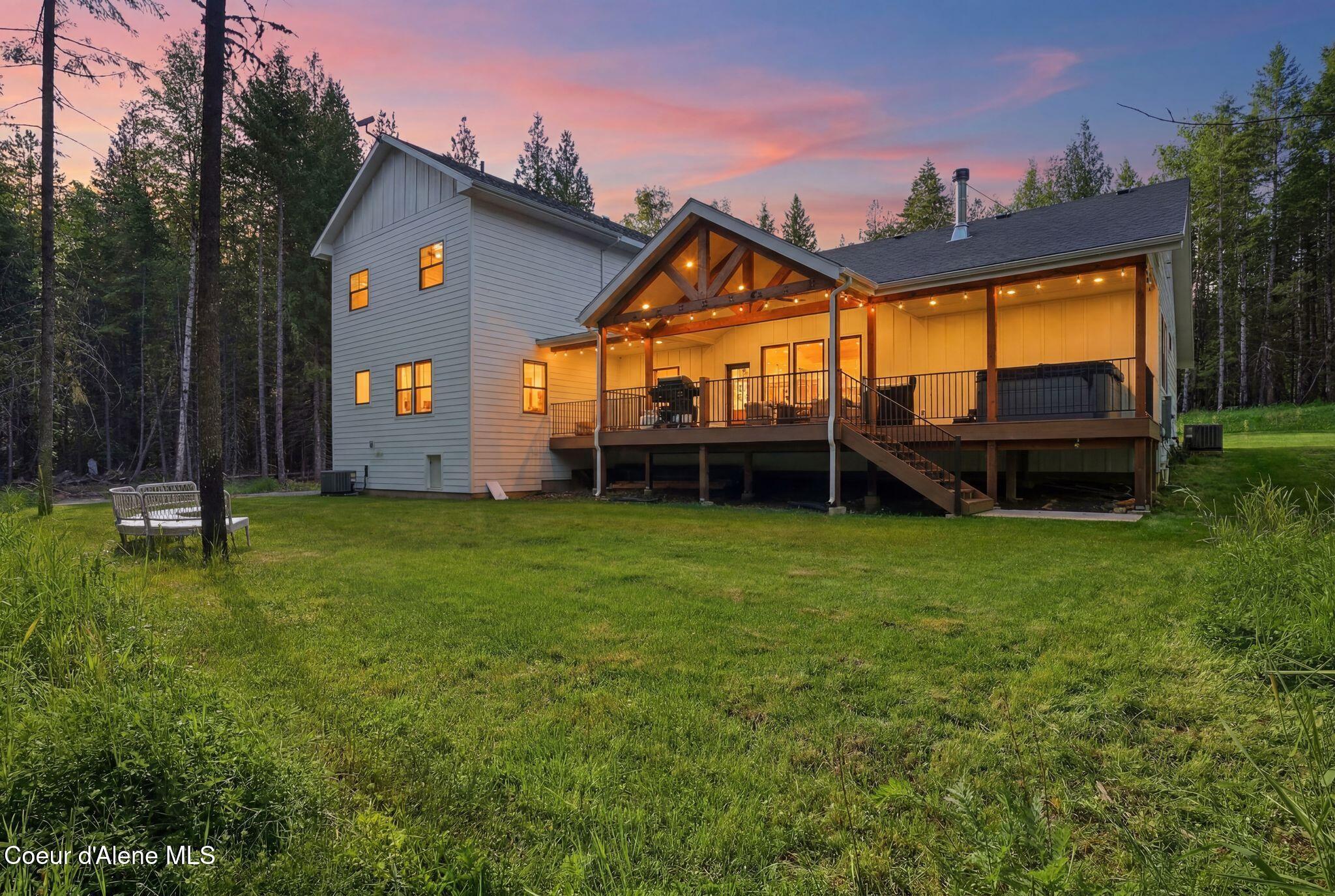 95 Klickitat Road Cocolalla, ID 83813 - Photo 4 of 66 Back Exterior at Dusk