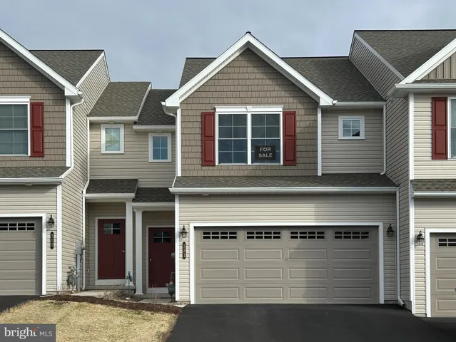 a front view of a house with a garage