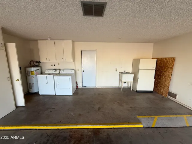 a view of a kitchen with wooden floor