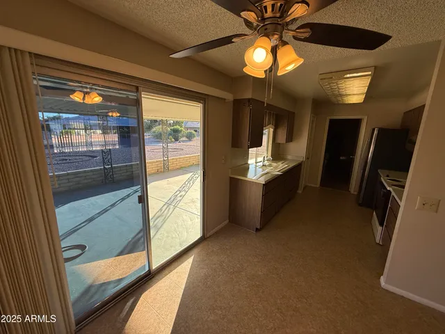 a view of a kitchen with a sink and dishwasher