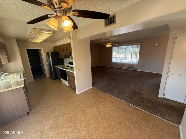 a view of a kitchen with a sink cabinets and a kitchen