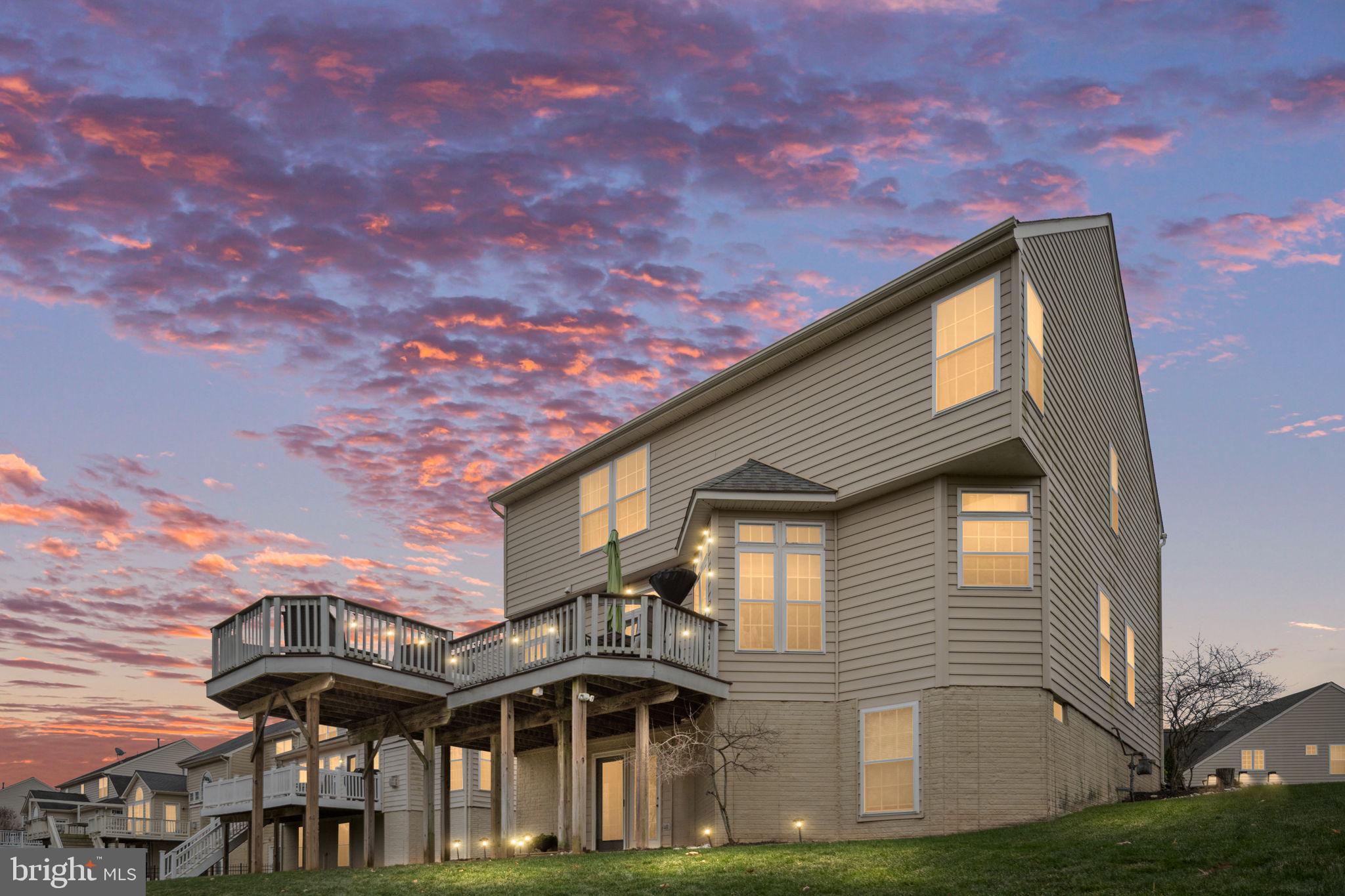 5505 Altenbury Loop Gainesville, VA 20155 - Photo 3 of 62 a front view of a house with a yard