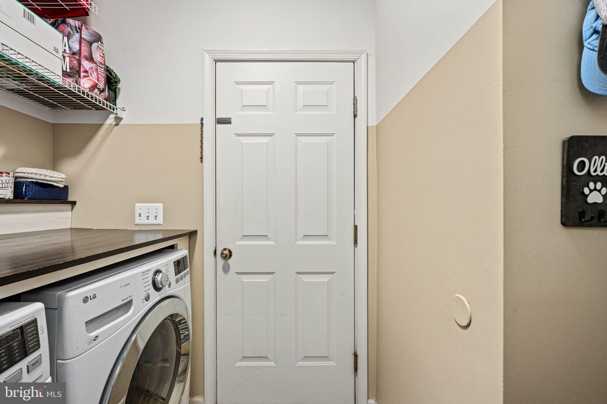 5505 Altenbury Loop Gainesville, VA 20155 - Photo 31 of 62 a view of a storage and utility room with washer and dryer
