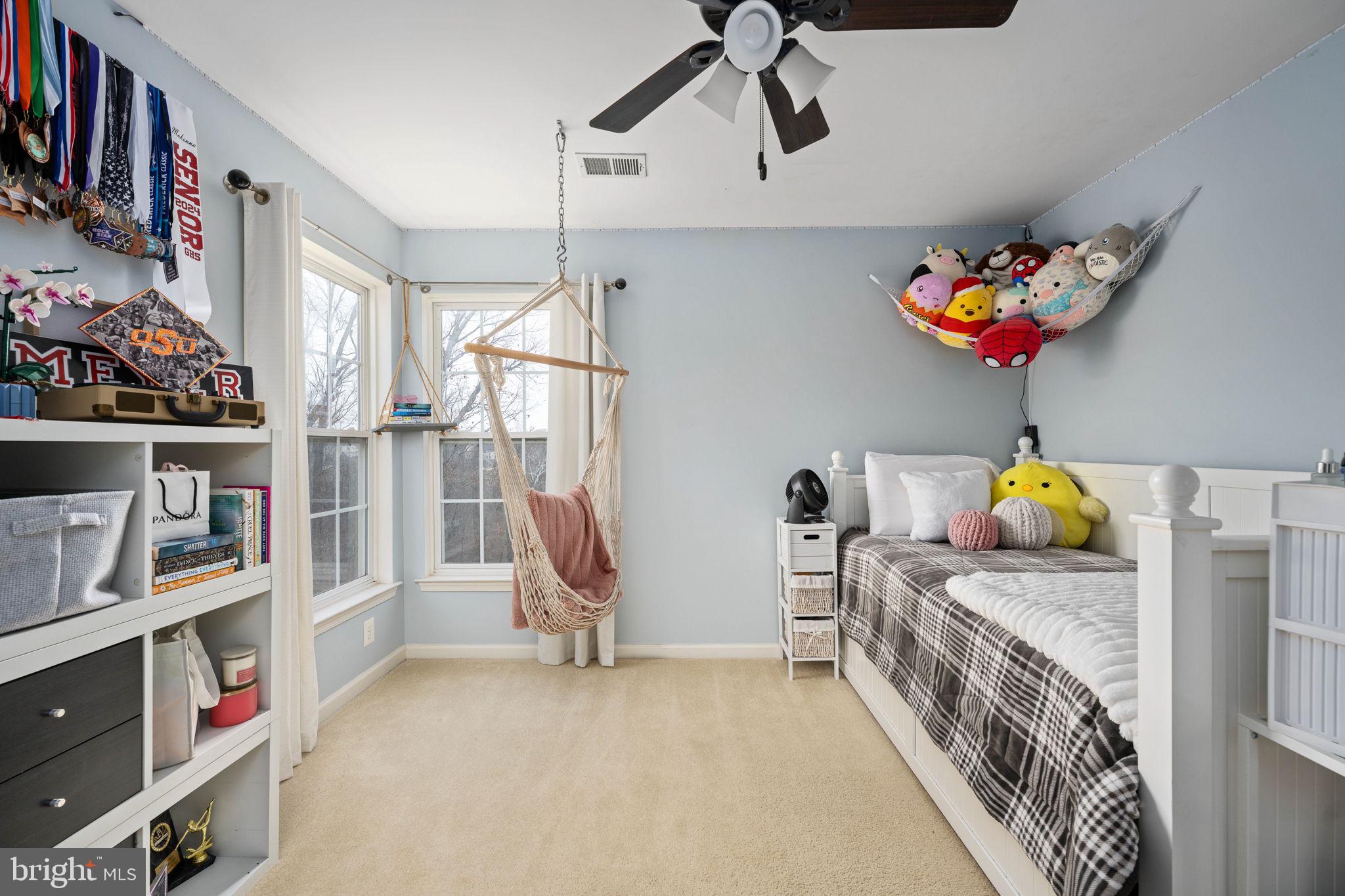 5505 Altenbury Loop Gainesville, VA 20155 - Photo 35 of 62 a bedroom with furniture a baby crib and a couch