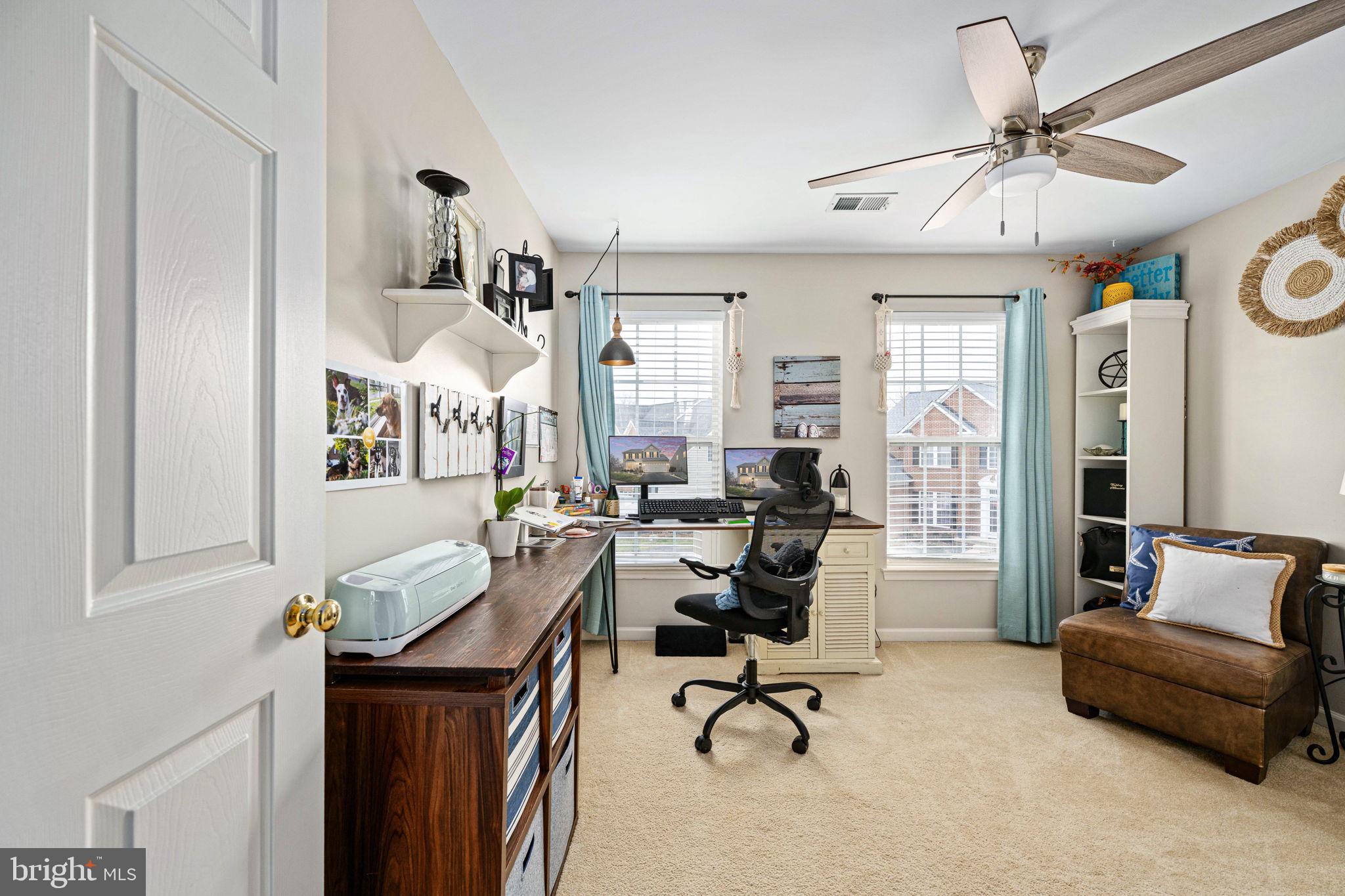 5505 Altenbury Loop Gainesville, VA 20155 - Photo 36 of 62 a view of a livingroom with workspace and a couch