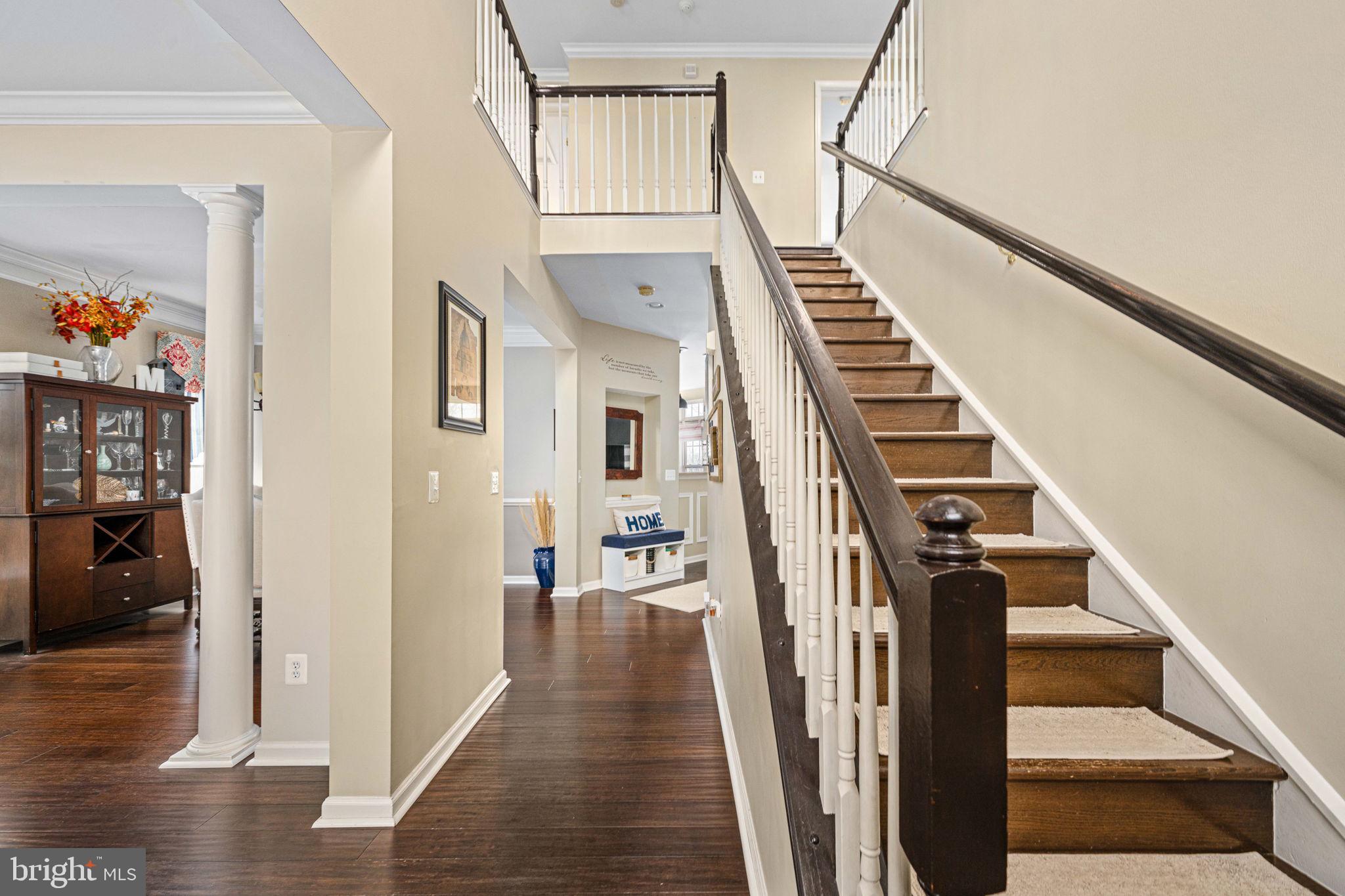 5505 Altenbury Loop Gainesville, VA 20155 - Photo 6 of 62 a view of an entryway with wooden floor