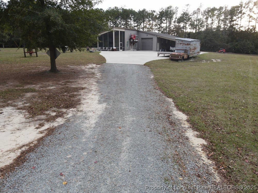 5671 Stewart Road Godwin, NC 28344 - Photo 11 of 34 a view of a house with a park