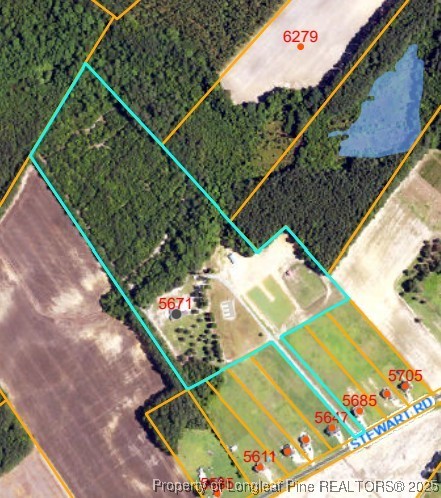 5671 Stewart Road Godwin, NC 28344 - Photo 2 of 34 a view of a tennis court