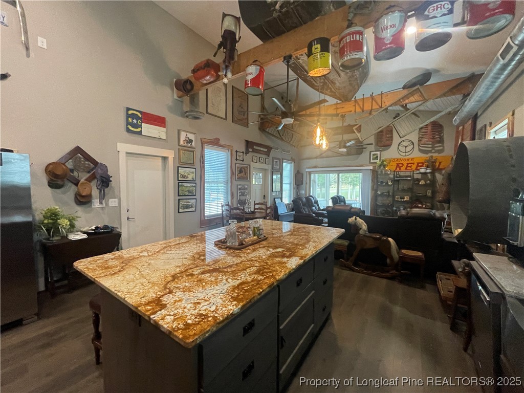5671 Stewart Road Godwin, NC 28344 - Photo 21 of 34 a kitchen with stainless steel appliances granite countertop a sink and cabinets