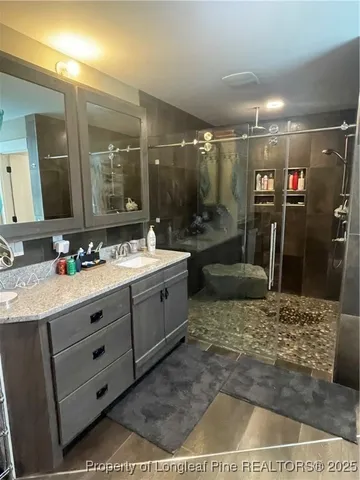 a white toilet sitting next to a bathroom sink