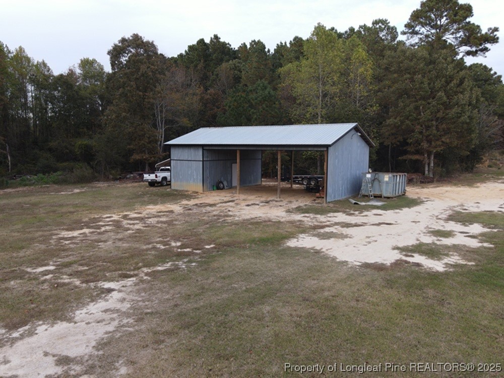 5671 Stewart Road Godwin, NC 28344 - Photo 9 of 34 a view of a house with a backyard of a house