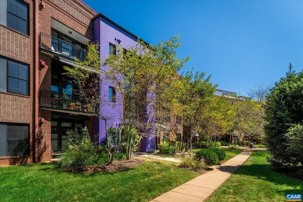 a view of a building with a yard
