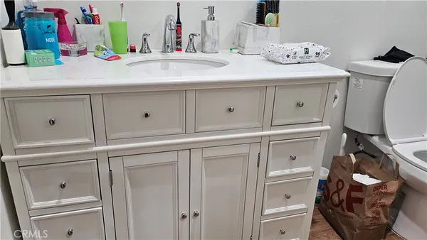 a bathroom with a sink and toilet