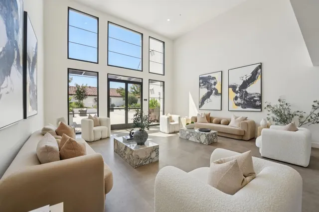 a living room with furniture or couch and a large window