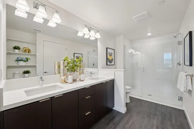 a bathroom with a double vanity sink and a mirror