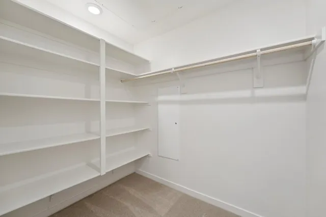 a view of an empty walk in closet