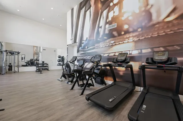 an empty room with windows and bathroom