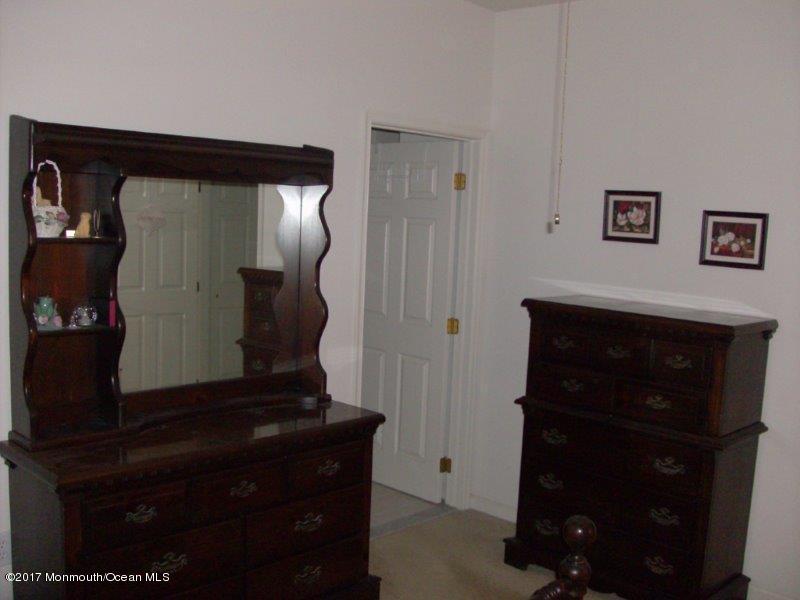 45 Tennyson Road Brick, NJ 08724 - Photo 13 of 23 a bathroom with a sink and a mirror