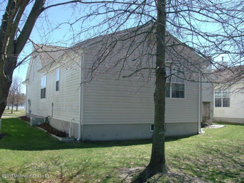 45 Tennyson Road Brick, NJ 08724 - Photo 20 of 23 a view of a white house next to a yard with big trees