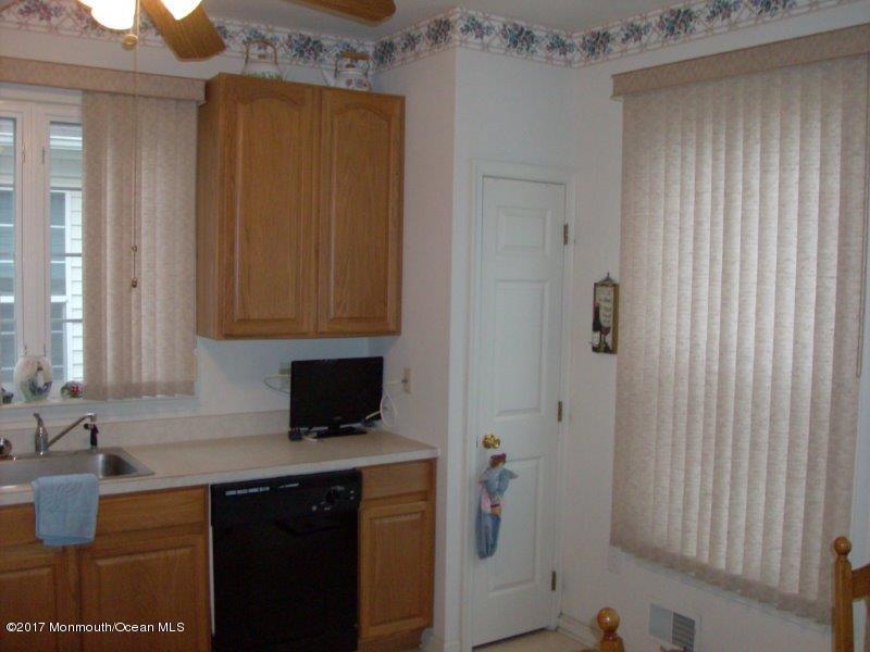 45 Tennyson Road Brick, NJ 08724 - Photo 8 of 23 a kitchen with a sink and a refrigerator