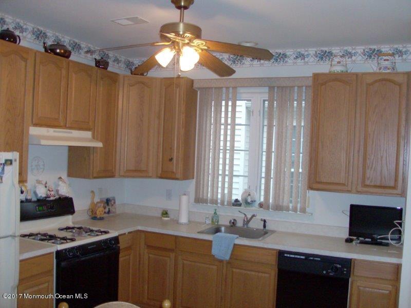 45 Tennyson Road Brick, NJ 08724 - Photo 9 of 23 a kitchen with stainless steel appliances granite countertop a sink stove and cabinets