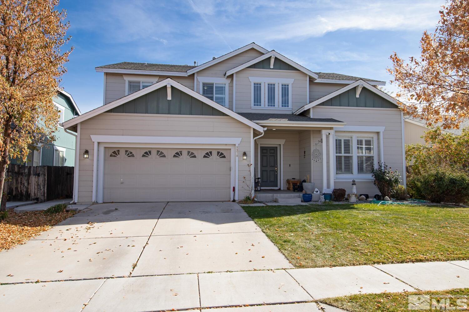 8970 Sorcha Street Reno, NV 89506 - Photo 1 of 38 a front view of a house with a yard and garage
